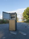 Discarded refrigerator with open door left on roadside Royalty Free Stock Photo
