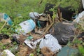 Fly tipping rubbish and rubbish sacks, old tyres thrown in to woodland near roadside In North Yorkshire UK
