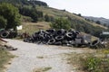 Discarded tires in the countryside. Environmental pollution.