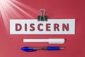 Discern text on paper on red background Royalty Free Stock Photo