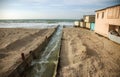 Discharge of dirty industrial wastewater into sea. Poisoning of recreation area by spread of disease, destruction of flora and Royalty Free Stock Photo