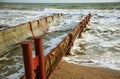 Discharge of dirty industrial wastewater into sea. Poisoning of recreation area by spread of disease, destruction of flora and Royalty Free Stock Photo