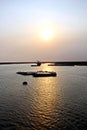 Discharging the vessel in the port of Saigon, Vietnam, the Mekong River. Views of berths, river banks and ships,tugs.