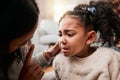 Discipline, angry and mother with girl, home and unhappy with expression, crying and naughty. Serious, female child and Royalty Free Stock Photo