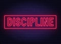 Discipline neon sign on dark background.