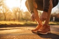 Disciplined Man tying shoelaces before training. Generate Ai Royalty Free Stock Photo