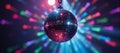 Disco ball against colorful light backdrop for event promotions Royalty Free Stock Photo