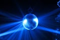 Disco ball with blue bright rays Royalty Free Stock Photo