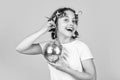 disco ball decoration. lovely girl with disco ball. Fashion girl posing in curlers on yellow wall. saturday night and Royalty Free Stock Photo