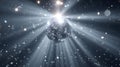 Disco Ball Glows with Light Rays and Falling Confetti at Party Royalty Free Stock Photo