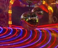 A disco ball over a spinning ride Royalty Free Stock Photo