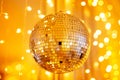 Disco ball for party for new year, golden mood color glow, flicker. Christmas day concept Royalty Free Stock Photo