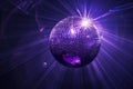 Vibrant Purple Disco Ball with Light Rays Royalty Free Stock Photo