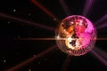 Disco ball reflecting light on black background. Nightclub decor Royalty Free Stock Photo