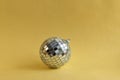 Disco ball with sparkle on golden background Royalty Free Stock Photo