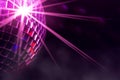 Disco ball with violet star burst and fog in club Royalty Free Stock Photo