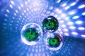 Disco balls with bright rays and highlights at the night disco in the club. Background image Royalty Free Stock Photo