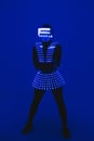 Disco dancer moves in UV suit. Royalty Free Stock Photo