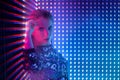 Disco dancer in neon light in night club. Fashion model woman in neon light Royalty Free Stock Photo