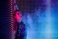 Disco dancer in neon light in night club. Fashion model woman in neon light Royalty Free Stock Photo