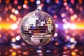 Disco or mirror ball with rainbow on colorful dark background with lights and sparcles. Royalty Free Stock Photo