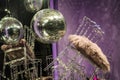 Disco sphere. The scattered chairs and glasses, champagne bottles. Exposition. Decorative show-window. Pink colors. Chaos.