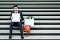 Disconsolate businessman holding a blank sign Royalty Free Stock Photo