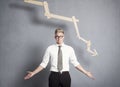 Discontented businessman in front of graph with negative trend. Royalty Free Stock Photo