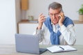 Discontented Elderly Man Calling To Customer Support Sitting At Workplace Royalty Free Stock Photo