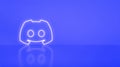 Discord logo in neon on purple background Royalty Free Stock Photo