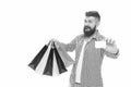 Discount is applied here. Bearded man smiling with discount card and paperbags isolated on white. Happy hipster shopping