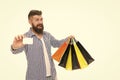 Discount is applied here. Bearded man smiling with discount card and paperbags on white. Happy hipster shopping