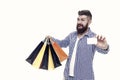 Discount is applied here. Bearded man smiling with discount card and paperbags isolated on white. Happy hipster shopping