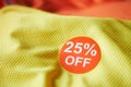 25 discount sakes tag on yellow color cloth Royalty Free Stock Photo