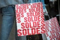 Discount sign `SOLDES ` in french,  the traduction of  sales  on paper bags in french a fashion store showroom Royalty Free Stock Photo
