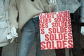 Discount sign `SOLDES ` in french,  the traduction of  sales  on paper bags in french a fashion store showroom Royalty Free Stock Photo