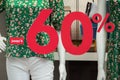 Discount sign - 60% on window in fashion store