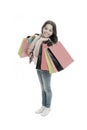 Discounts and promo codes. Girl carries shopping bags isolated on white background. Girl fond of shopping. Child cute Royalty Free Stock Photo