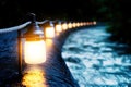 Discover a captivating glowing path, a luminous array of lights along a dark river representing the layers of internet safety with