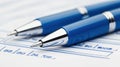 Discover a closeup view of two pens resting on a filledout checkbox form, symbolizing successful completion of tasks and Royalty Free Stock Photo