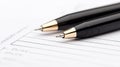 Discover a closeup view of two pens resting on a filledout checkbox form, symbolizing successful completion of tasks and Royalty Free Stock Photo