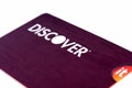 Discover credit card close up on white background. Selective focus with shallow depth of field