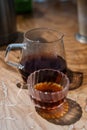 Tranquil Coffee Moment: Glass Carafe and Ornate Cup on Wooden Table Royalty Free Stock Photo