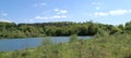 a quiet lake in Germany, surrounded by trees, forest and bushes Royalty Free Stock Photo