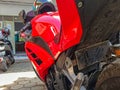 Urban Adventure: Red Kawasaki Ninja Motorcycle at Rest in Sukoharjo's Paved Courtyard