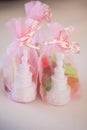 Discover white wedding cake souvenirs in elegant pink organza bags for your special day