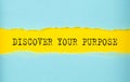 DISCOVER YOUR PURPOSE text on the torn paper , yellow background Royalty Free Stock Photo