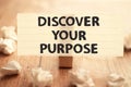 Discover your purpose, text words typography written on paper against wooden background, life and business motivational