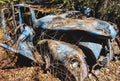 Antique beat up car found in the bush