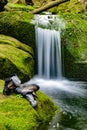 Discoverer boots and socks on mossy stone and relaxing